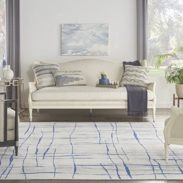 HomeRoots 7' Elegant Ivory and Blue Abstract Distressed Area Rug - Durable, Stain-Resistant, Stylish Design 7' X 10' 550635