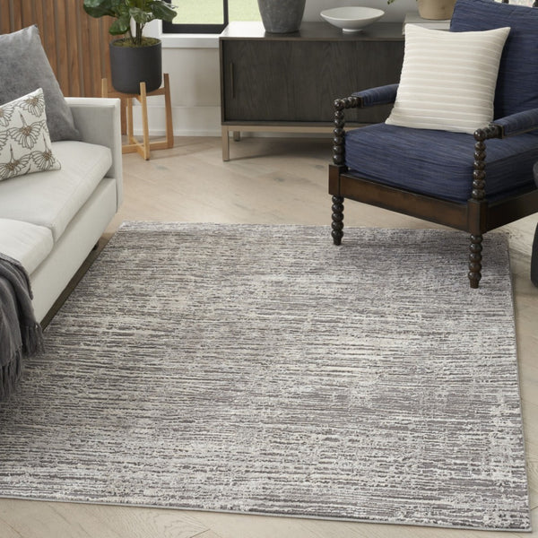 HomeRoots 5' Abstract Ivory and Gray Non-Skid Area Rug - Soft, Stain-Resistant, Durable for High-Traffic Spaces 6' X 9' 550728