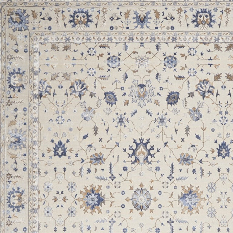 HomeRoots 8 X 11 Ivory Blue Tan Floral Power Loomed Synthetic Rug with Non Skid Backing 550753