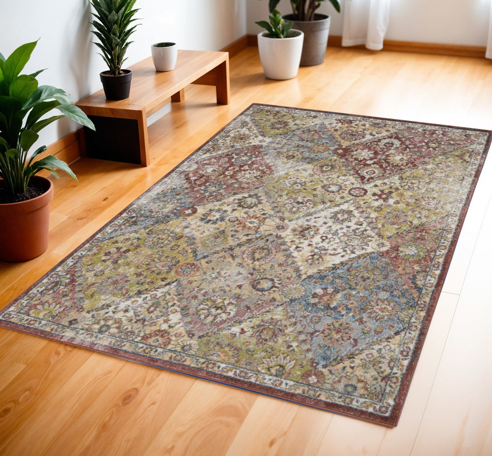 Homeroots 4' X 6' Green And Ivory Floral Distressed Area Rug  Polypropylene 550829