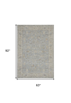 Homeroots 5' X 8' Beige And Blue Floral Power Loom Area Rug  Polypropylene,Polyester 550869