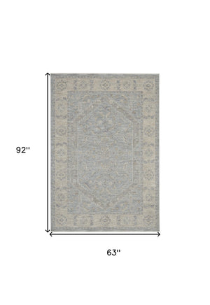Homeroots 5' X 8' Beige And Blue Floral Power Loom Area Rug  Polypropylene,Polyester 550870