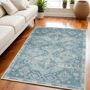 Homeroots 5' Ivory And Light Blue Medallion Distressed Area Rug - Durable, Stain Resistant, Stylish Design 5' X 7' Polypropylene 550871
