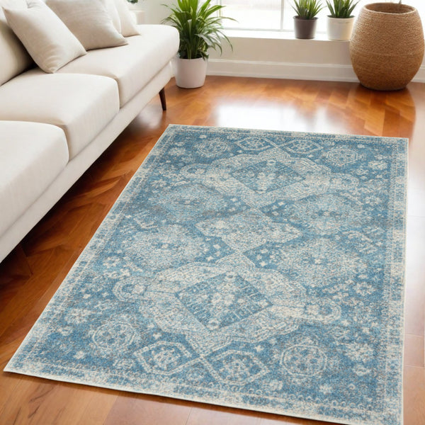 Homeroots 5' Ivory And Light Blue Medallion Distressed Area Rug - Durable, Stain Resistant, Stylish Design 5' X 7' Polypropylene 550871