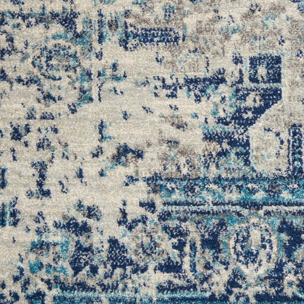 HomeRoots 5' Elegant Ivory and Light Blue Floral Medallion Distressed Area Rug for Timeless Home Style 5' X 7' 550895