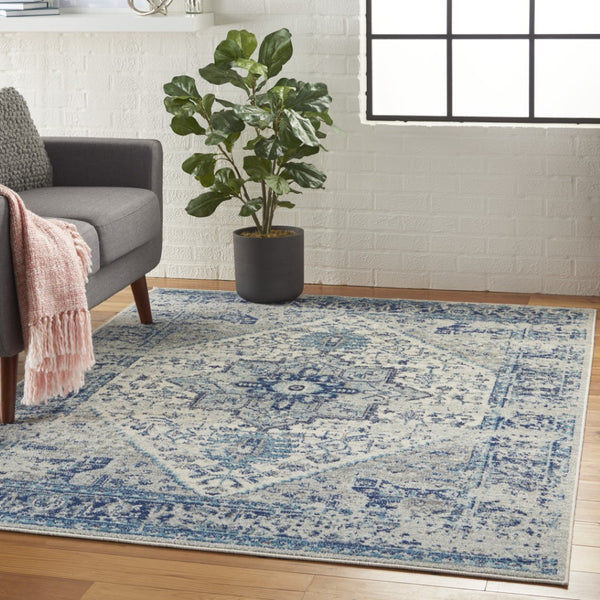 HomeRoots 5' Elegant Ivory and Light Blue Floral Medallion Distressed Area Rug for Timeless Home Style 5' X 7' 550895