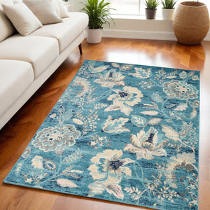 Homeroots 5' X 7' Turquoise Floral Area Rug - Stain Resistant, Durable, Perfect For Kids & Pets, Stylish Decor  Polypropylene 550897