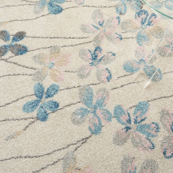 HomeRoots 5' Elegant Ivory and Blue Floral Area Rug - Durable, Stain-Resistant Design for Family Spaces 6' X 9' 550905