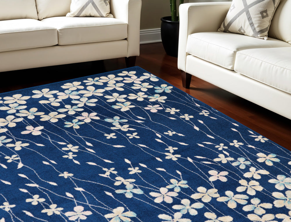 Homeroots 6' Navy Blue And Ivory Floral Area Rug - Durable, Stain Resistant, Ideal For Kids And Pets, 72x108" 6' X 9' Polypropylene 550992