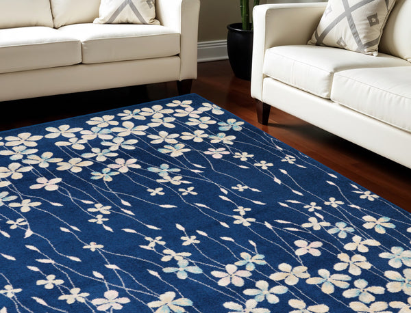 Homeroots 6' Navy Blue And Ivory Floral Area Rug - Durable, Stain Resistant, Ideal For Kids And Pets, 72x108" 6' X 9' Polypropylene 550992