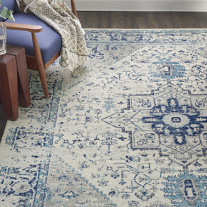 HomeRoots 7' Ivory and Light Blue Floral Medallion Distressed Area Rug - Durable, Elegant, and Versatile Design 551039