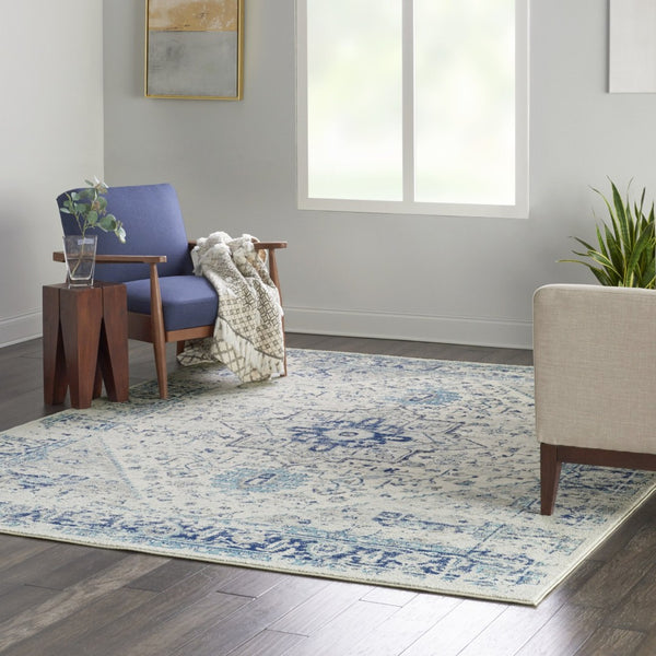 HomeRoots 7' Ivory and Light Blue Floral Medallion Distressed Area Rug - Durable, Elegant, and Versatile Design 551039