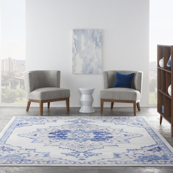 HomeRoots 7' Distressed Floral Medallion Area Rug in Ivory and Blue – Stain-Resistant, Non-Skid Comfort 8' X 10' 551043