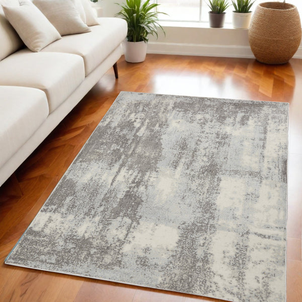 Homeroots 5' X 7' Gray Ivory And Light Blue Abstract Non Skid Area Rug  Polypropylene,Polyester 551195