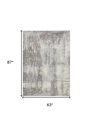 Homeroots 5' X 7' Gray Ivory And Light Blue Abstract Non Skid Area Rug  Polypropylene,Polyester 551195