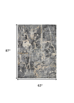 Homeroots 5' X 7' Ivory Black And Gray Abstract Distressed Area Rug  Polypropylene 551210