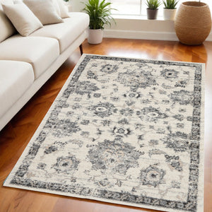 Homeroots 5' X 7' Cream And Gray Floral Distressed Area Rug  Polypropylene 551212
