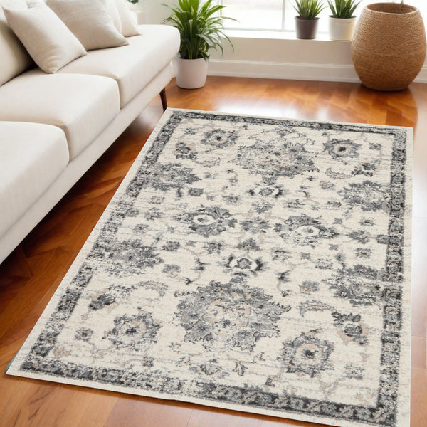 Homeroots 5' X 7' Cream And Gray Floral Distressed Area Rug  Polypropylene 551212