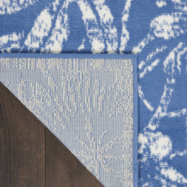 HomeRoots 7' Ivory and Blue Floral Distressed Area Rug - Timeless Charm for High-Traffic Spaces and Homes 8' X 12' 551357