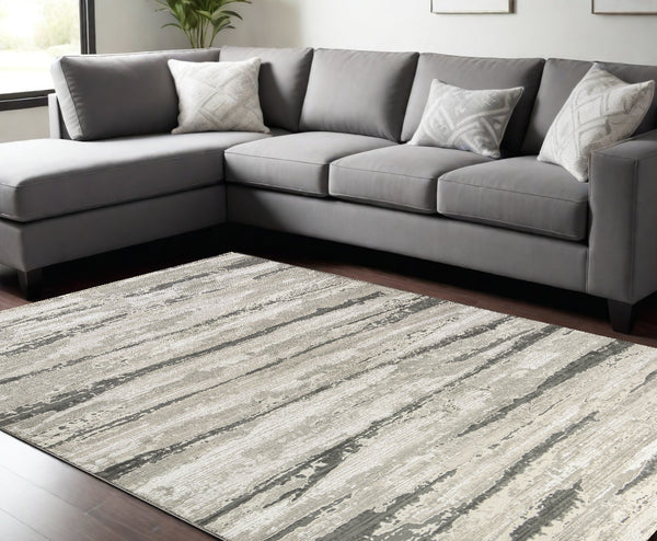 Homeroots 9' X 12' Beige Ivory And Gray Abstract Non Skid Area Rug  Polyester 551381
