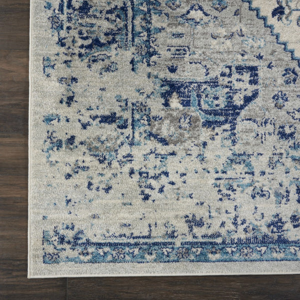 HomeRoots 8' Ivory and Light Blue Floral Medallion Distressed Area Rug - Timeless Elegance for Any Space 9' X 12' 551393
