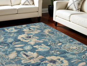 Homeroots 9' Turquoise And Cream Floral Distressed Area Rug - Durable, Stain Resistant, Ideal For Homes With Kids  Polypropylene 551395