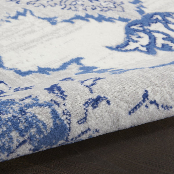 HomeRoots 7' Distressed Floral Medallion Area Rug in Ivory and Blue – Stain-Resistant, Non-Skid Comfort 8' X 12' 551405