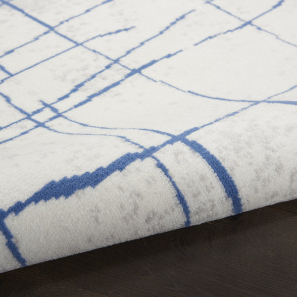 HomeRoots 7' Elegant Ivory and Blue Abstract Distressed Area Rug - Durable, Stain-Resistant, Stylish Design 8' X 12' 551410