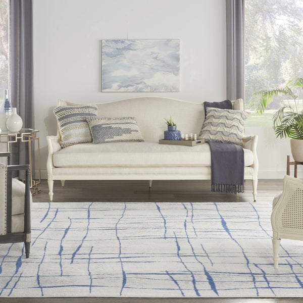 HomeRoots 7' Elegant Ivory and Blue Abstract Distressed Area Rug - Durable, Stain-Resistant, Stylish Design 8' X 12' 551410