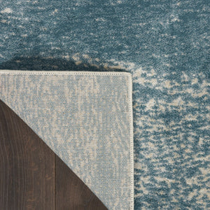 HomeRoots 5' Teal and Ivory Abstract Area Rug – Stain-Resistant, Non-Skid, Durable Design for Modern Spaces 9' X 13' 551509