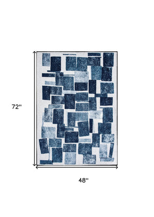 Homeroots 5' X 7' Blue And White Geometric Non Skid Area Rug  100% Pet 551931