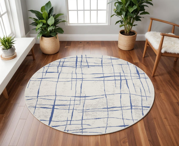 HomeRoots 8' Abstract Distressed Ivory and Blue Rug - Modern Geometric Design for Stylish, Family-Friendly Spaces 8' Round 552301