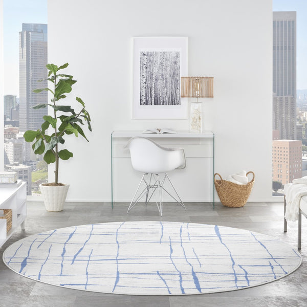 HomeRoots 8' Abstract Distressed Ivory and Blue Rug - Modern Geometric Design for Stylish, Family-Friendly Spaces 8' Round 552301