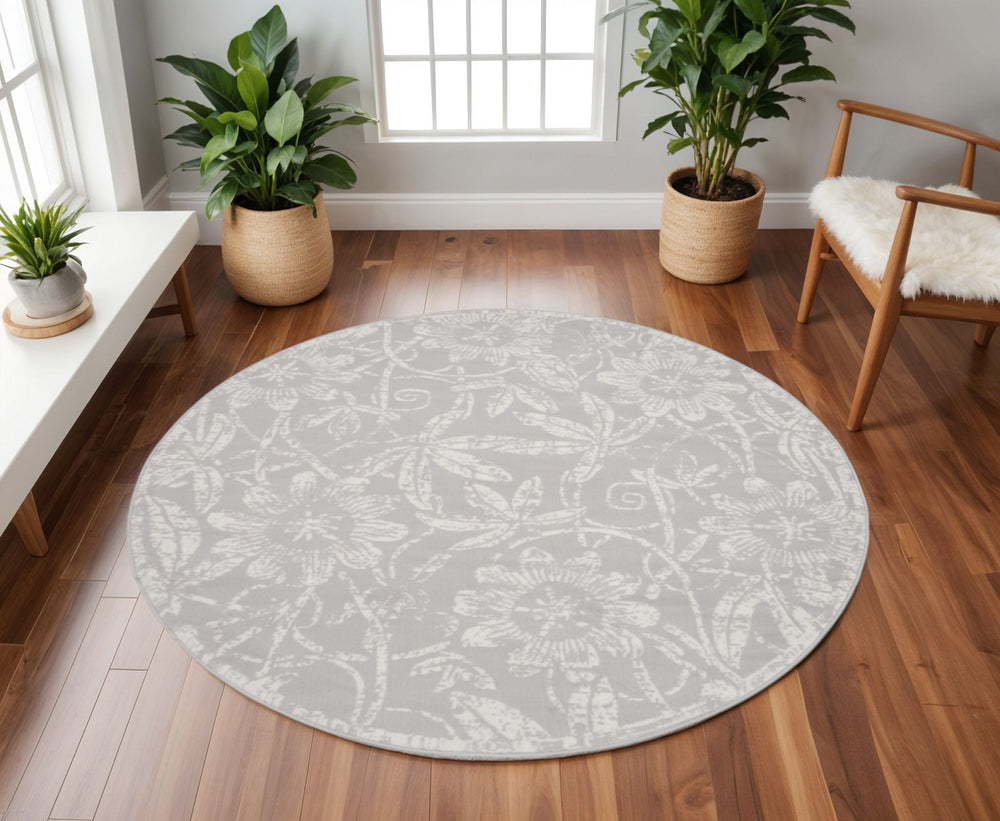Homeroots 8' Ivory And Gray Floral Distressed Round Rug – Durable, Stain Resistant, Cozy Cottage Style Accent Piece  Polyester 552302