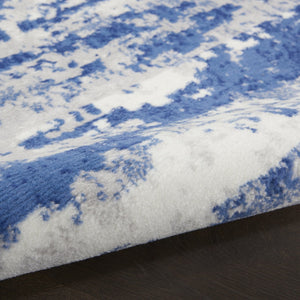 HomeRoots 8' Ivory and Navy Blue Abstract Area Rug - Modern Durable Design for Family-Friendly Spaces 8' Round 552308