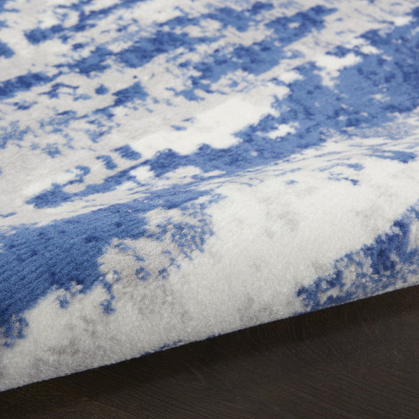 HomeRoots 8' Ivory and Navy Blue Abstract Area Rug - Modern Durable Design for Family-Friendly Spaces 8' Round 552308