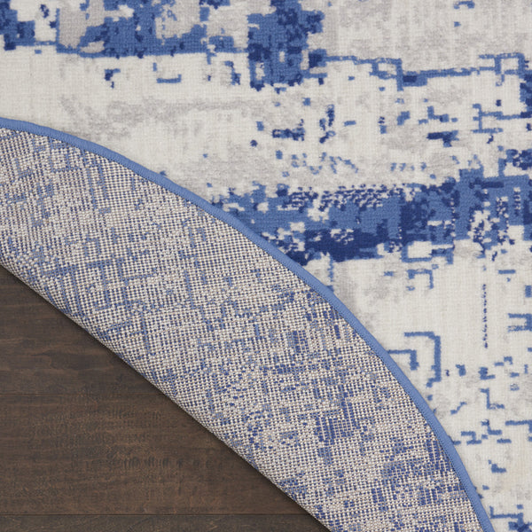 Homeroots 8' Ivory And Navy Blue Abstract Round Rug  Polypropylene 552308