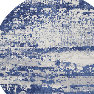 Homeroots 8' Ivory And Navy Blue Abstract Round Rug  Polypropylene 552308