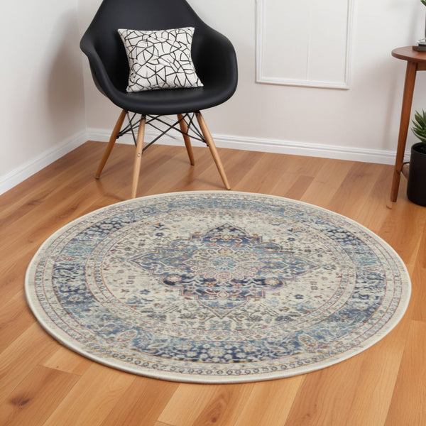 Homeroots 6' Ivory Blue & Orange Floral Distressed Round Rug - Stain Resistant, Durable, Stylish Home Decor Accent  Polypropylene 552354
