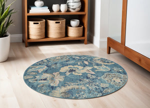 Homeroots 5' Turquoise Cream & Navy Floral Distressed Round Rug - Durable, Stain-resistant, Stylish Decor Piece  Polypropylene 552385