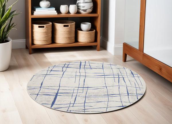 Homeroots 5' Ivory And Blue Abstract Geometric Distressed Round Rug  Polypropylene 552403