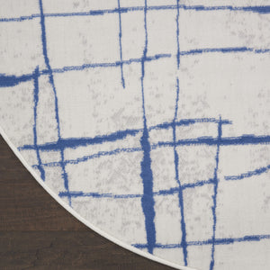 Homeroots 5' Ivory And Blue Abstract Geometric Distressed Round Rug  Polypropylene 552403