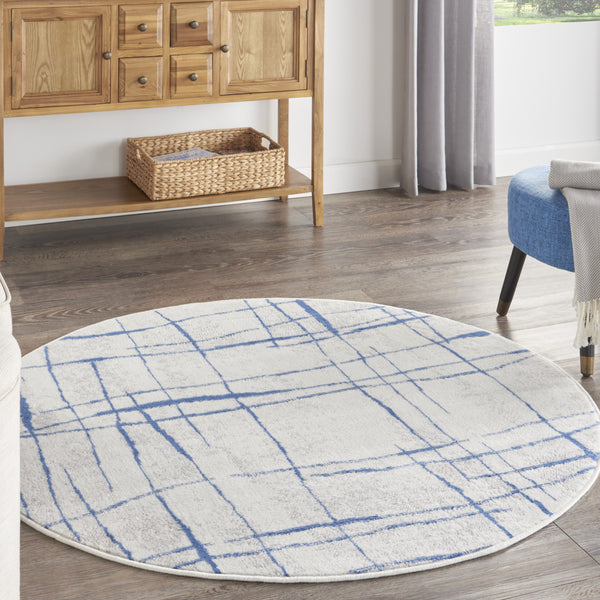 Homeroots 5' Ivory And Blue Abstract Geometric Distressed Round Rug  Polypropylene 552403