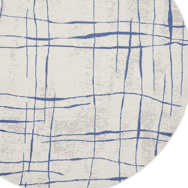 Homeroots 5' Ivory And Blue Abstract Geometric Distressed Round Rug  Polypropylene 552403