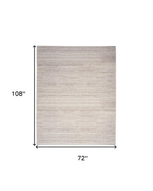 Homeroots 9' Ivory And Light Brown Abstract Washable Area Rug – Modern Artistry For Your Home Décor Needs 6' X 9' Polyester Blend 552551