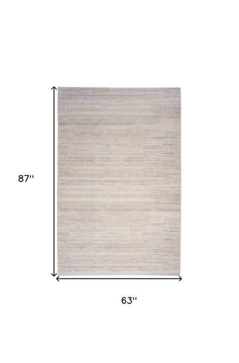 Homeroots 9' Ivory And Light Brown Abstract Washable Area Rug – Modern Artistry For Your Home Décor Needs 5' X 7' Polyester Blend 552561