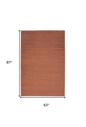 Homeroots 9' Brick Red Abstract Washable Area Rug – Stylish, Modern Design To Enhance Any Room's Warmth! 5' X 7' Polyester Blend 552566