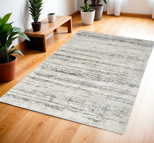 Homeroots 4' X 6' Cream And Gray Abstract Non Skid Area Rug  Polyester 552814