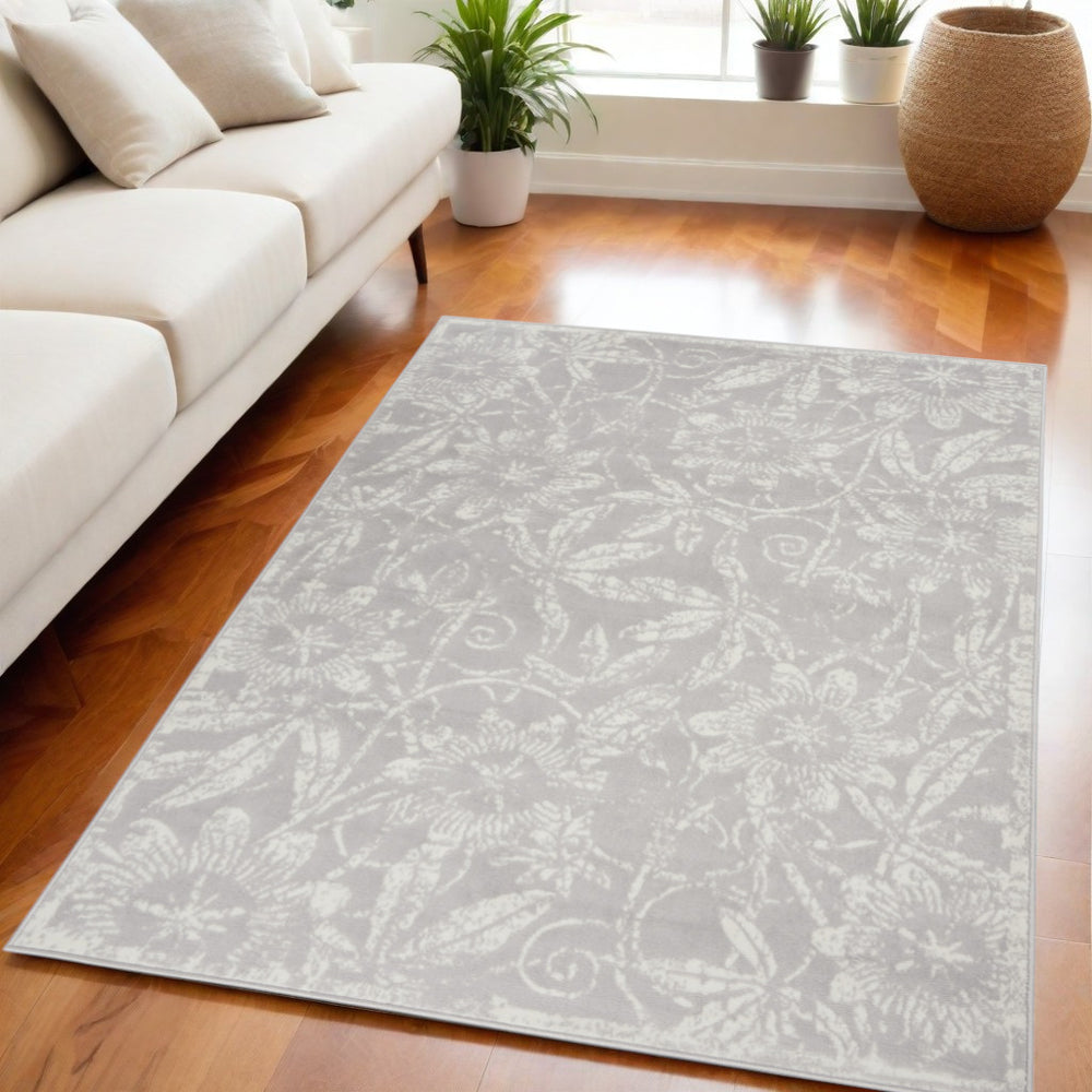Homeroots 7' Ivory And Gray Floral Distressed Non-skid Area Rug - Perfect For Pets, Stain-resistant & Durable 5' X 7' Polyester 553044