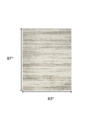 Homeroots 5' X 7' Cream Abstract Distressed Area Rug  Synthetic 553159